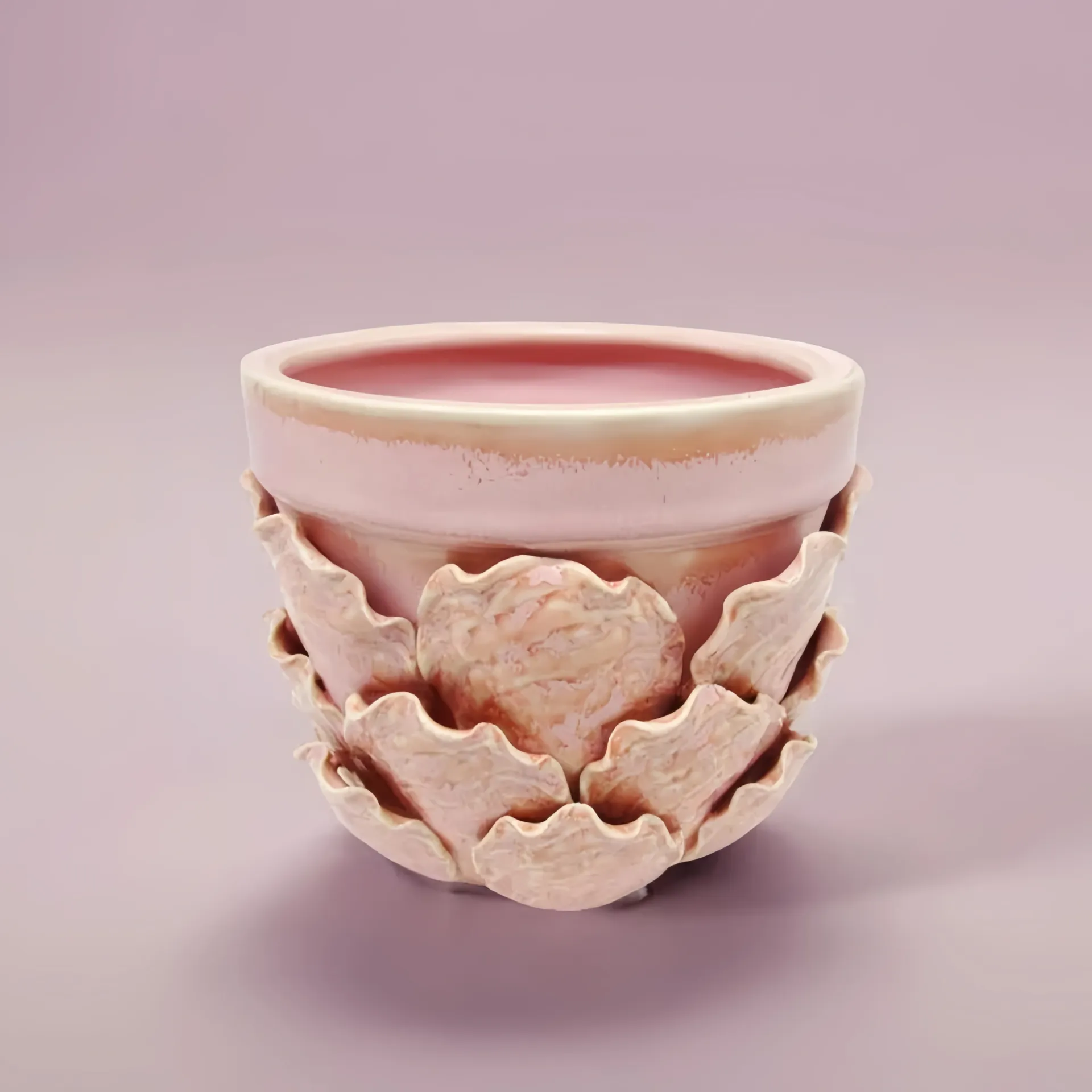A pink ceramic pot with a decorative layered design against a soft pink background.
