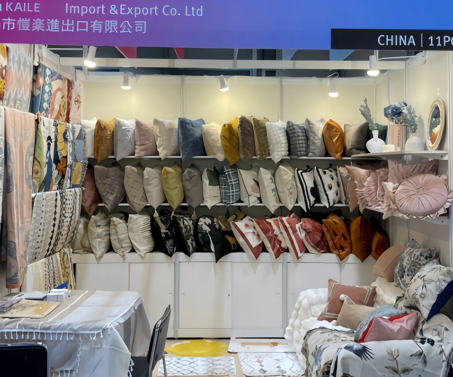A booth displaying a variety of decorative cushions and pillow covers.