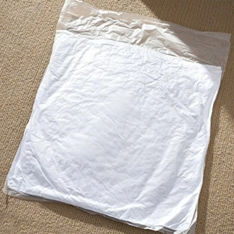 A large, crumpled white plastic bag laid flat on a beige textile surface.
