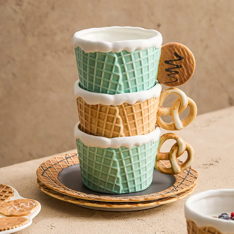 Stacked ceramic cups designed to look like ice cream cones with matching plates.